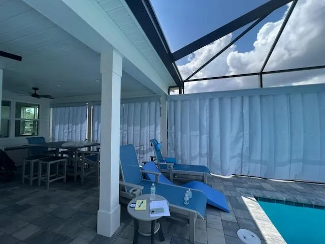 Gray outdoor curtains on covered lanai