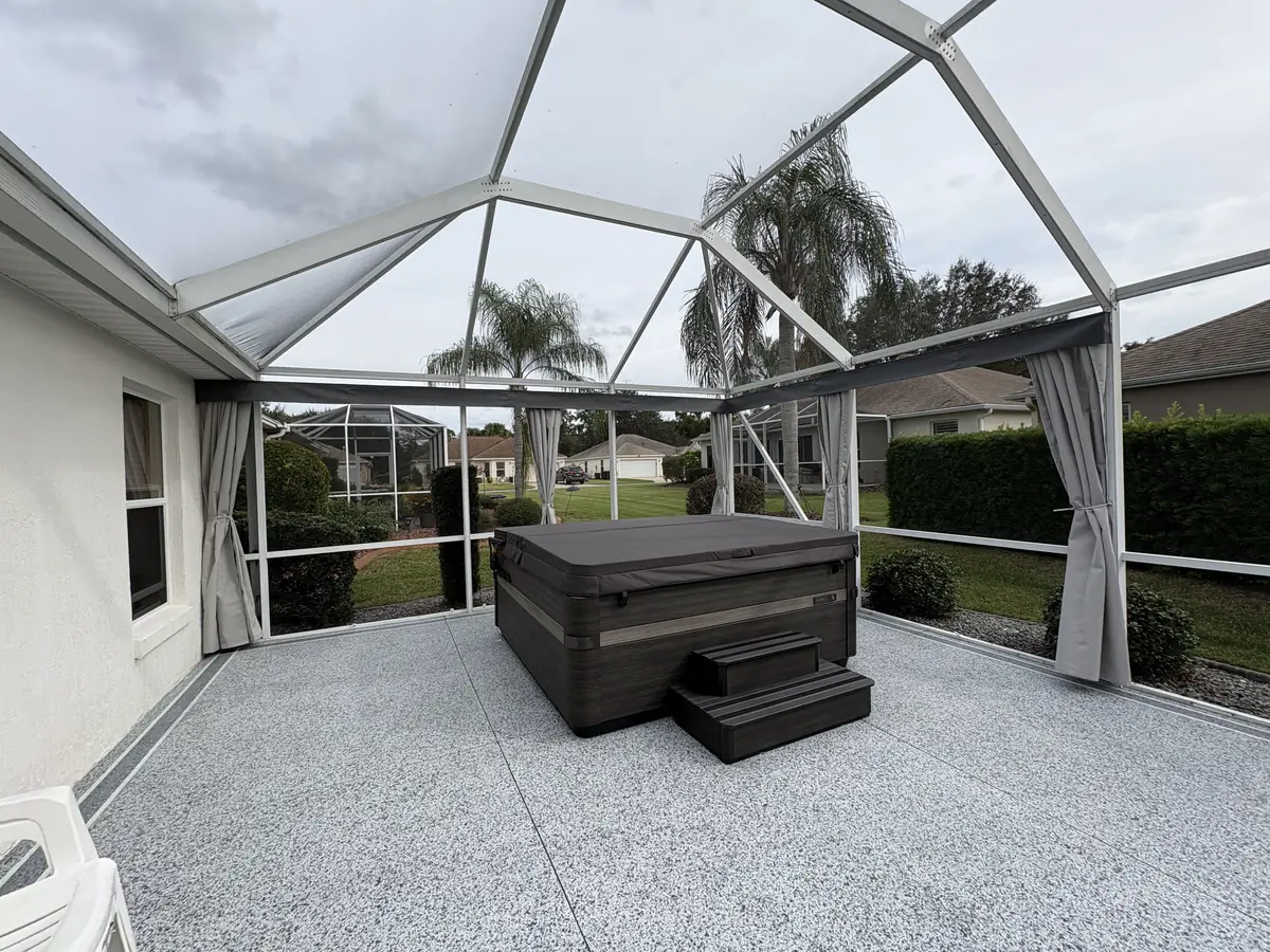 White tie-back privacy curtains around a hot tub in a screen enclosure